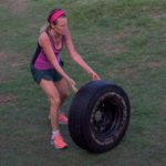 Woman flipping a tyre